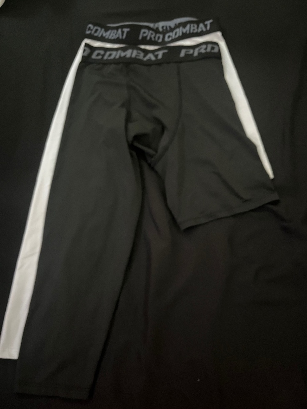 Black and white one leg sleeve compression tights